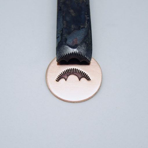 Ridged Sunray with Three Curved Border Stamp 212